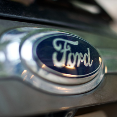 close up of ford motor company logo on a car